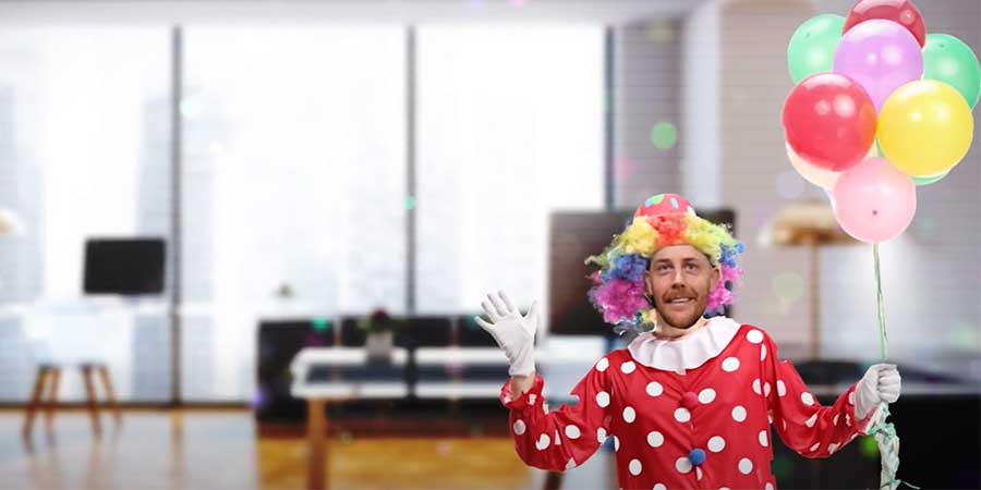 man dressed up as a clown at work